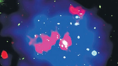 Optical photograph of the cluster of galaxies, whose central giant elliptical galaxy (white elliptical patch) is the parent of the radio lobes shown in red. The blue region displays the halo of X-ray emission due to the hot gas associated with this cluster of galaxies and has an overall size of 1.7 million light-years. (SOURCES) Optical photograph of the cluster of galaxies, whose central giant elliptical galaxy (white elliptical patch) is the parent of the radio lobes shown in red. The blue region displays the halo of X-ray emission due to the hot gas associated with this cluster of galaxies and has an overall size of 1.7 million light-years. (SOURCES)
