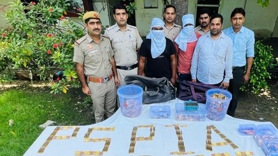 Delhi: A photo of the accused along with officials was shared by news agency ANI. Delhi: A photo of the accused along with officials was shared by news agency ANI. 
