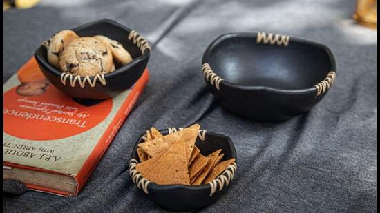 These aesthetic handmade Longpi pottery bowls made with black clay found in Manipur are ideal for snacks to accompany your drinks. (Longpi Ebony Bowls by Soignne)