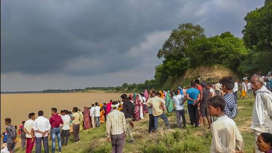 Seventeen people are still missing while three bodies were found after a mid-size boat capsized in the Yamuna River in the Banda district, officials said on Friday. (PTI) Seventeen people are still missing while three bodies were found after a mid-size boat capsized in the Yamuna River in the Banda district, officials said on Friday. (PTI)