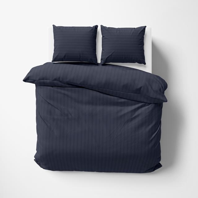 This tone-on-tone striped duvet cover feels good and looks both masculine and sophisticated. (Egyptian cotton duvet set in Navy blue by Vaaree) This tone-on-tone striped duvet cover feels good and looks both masculine and sophisticated. (Egyptian cotton duvet set in Navy blue by Vaaree)