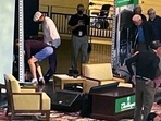 Author Salman Rushdie, behind screen left, is tended to after he was attacked during a lecture at the Chautauqua Institution in Chautauqua, New York.(AP) Author Salman Rushdie, behind screen left, is tended to after he was attacked during a lecture at the Chautauqua Institution in Chautauqua, New York.(AP)