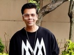 Karan Johar poses in Mumbai at an event.