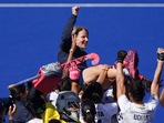 India coach Janneke Schopman is lifted into the air by her team (AP) India coach Janneke Schopman is lifted into the air by her team (AP)
