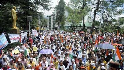Employees stage protest seeking restoration of the Old Pension Scheme at Chaura Maidan near Himachal Pradesh Vidhan Sabha in Shimla on Saturday. (Deepak Sansta/HT)