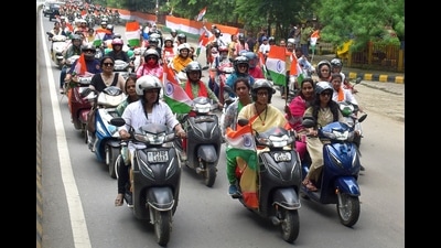 Union minister Smriti Irani riding a scooty during the rally in Prayagraj on Saturday. (HT PHOTO) Union minister Smriti Irani riding a scooty during the rally in Prayagraj on Saturday. (HT PHOTO)