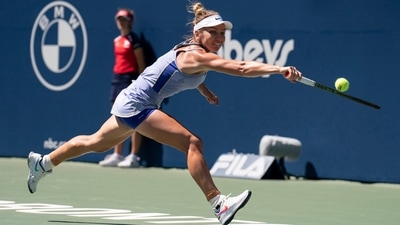Romania's Simona Halep stretches to reach a shot from United States' Coco Gauff during Women's National Bank Open tennis match (AP) Romania's Simona Halep stretches to reach a shot from United States' Coco Gauff during Women's National Bank Open tennis match (AP)