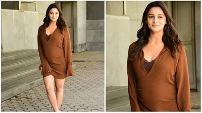 Alia Bhatt earlier flaunted her baby bump in a short brown wrap dress featuring a plunging neckline. (HT Photo/Varinder Chawla) Alia Bhatt earlier flaunted her baby bump in a short brown wrap dress featuring a plunging neckline. (HT Photo/Varinder Chawla)