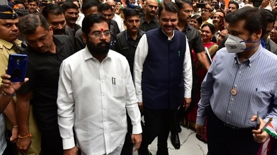 Mumbai, India : CM Eknath Shinde and Dy CM Devendra Fadnavis along with Mantralaya staff wave Indian national flags while participating in the "Har Ghar Tiranga" campaign.&nbsp; (Anshuman Poyrekar/HT PHOTO)