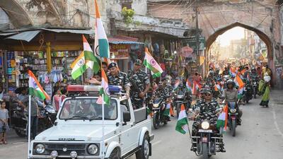 Security personnel taking out Tiranga Yatra in Ayodhya on Saturday. (PTI PHOTO) Security personnel taking out Tiranga Yatra in Ayodhya on Saturday. (PTI PHOTO)
