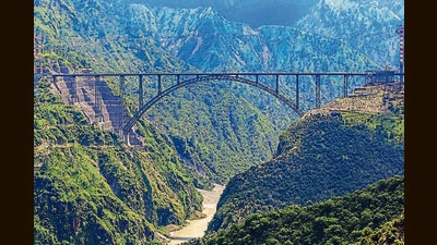 World's highest single-arch railway bridge over the Chenab river, in Reasi district, on Saturday. (PTI) World's highest single-arch railway bridge over the Chenab river, in Reasi district, on Saturday. (PTI)