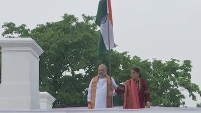 Union Home Minister Amit Shah and his wife Sonal Shah unfurled the tricolour at their residence in New Delhi on Saturday. (ANI) Union Home Minister Amit Shah and his wife Sonal Shah unfurled the tricolour at their residence in New Delhi on Saturday. (ANI)