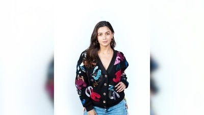 Alia Bhatt's quirky multi-coloured black open cardigan is from the Pre Fall 2022 collection of the luxury label Chanel. She teamed it with denim from Kanika Goyal Label. (Instagram/@stylebyami) Alia Bhatt's quirky multi-coloured black open cardigan is from the Pre Fall 2022 collection of the luxury label Chanel. She teamed it with denim from Kanika Goyal Label. (Instagram/@stylebyami)