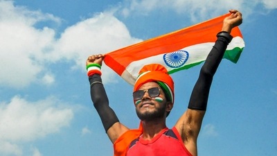 A youngster holds the tricolor during 'Azadi ka Amrit Mahotsav' celebrations for the upcoming Independence Day.&nbsp; (PTI)