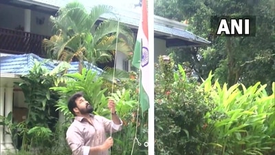 Actor and producer Mohanlal hoists the Tricolour at his residence in Kochi. (ANI)