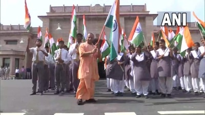 Yogi Adityanath, Chief Minister of Uttar Pradesh flags off Har Ghar Tiranga campaign with schoo children in Lucknow. (ANI)