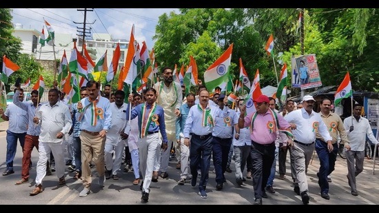 Kheri DM, ADM, CDO and others taking out ‘Tiranga Yatra’ in Lakhimpur on Saturday. (HT photo)