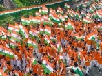 School children participate in a 'Har Ghar Tiranga' campaign, organised under the aegis of Azadi Ka Amrit Mahotsav, in New Delhi.(PTI) School children participate in a 'Har Ghar Tiranga' campaign, organised under the aegis of Azadi Ka Amrit Mahotsav, in New Delhi.(PTI)