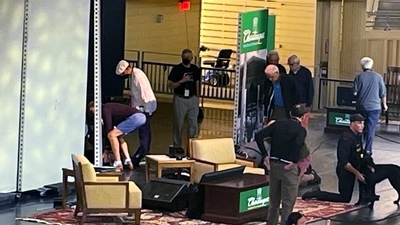 Author Salman Rushdie, behind screen left, is tended to after he was attacked during a lecture at the Chautauqua Institution in Chautauqua, New York. (AP) Author Salman Rushdie, behind screen left, is tended to after he was attacked during a lecture at the Chautauqua Institution in Chautauqua, New York. (AP)
