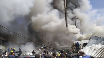 Smoke rises from Surmalu market about two kilometers (1.2 miles) south of the center Yerevan, Armenia. (AP)