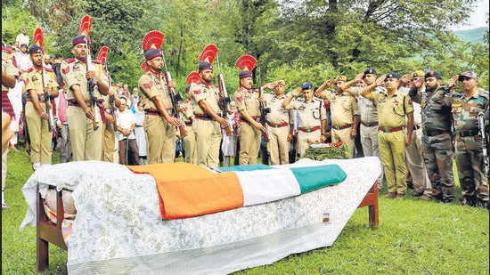 Poonch: Police personnel pay their last respects to policeman Tahir Khan, who was killed in a grenade attack by terrorists in J&K's Kulgam district, at Mendhar in Poonch district, Sunday, Aug. 14, 2022. (PTI Photo)(PTI08_14_2022_000239A) (PTI)