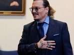  Johnny Depp gestures to spectators in court after closing arguments during his defamation case against ex-wife Amber Heard in May, 2022.(REUTERS)