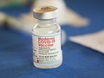 A vial of the Moderna vaccine rests on a table at an inoculation station next to Jackson State University in Jackson, Miss.