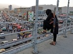 A Taliban fighter stands guard on a bridge in Kabul, Afghanistan,&nbsp;