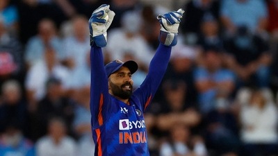 India's Dinesh Karthik celebrates taking a catch (Reuters)