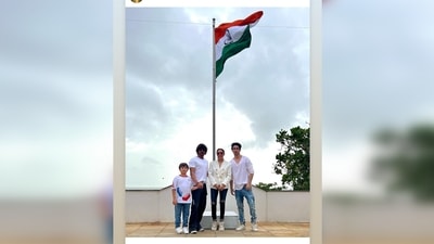 Shah Rukh Khan celebrated the 75th Independence Day with his wife Gauri Khan and sons AbRam Khan and Aaryan Khan. All dressed in white, they posed in front of the national flag. (Instagram/@gaurikhan)