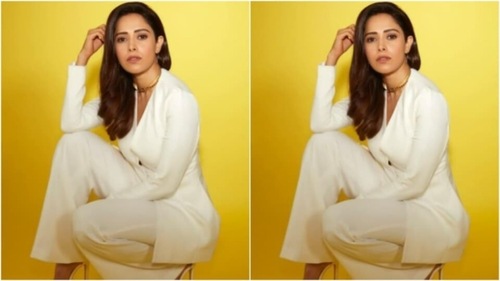 Nushrratt decked up in a white blazer with a plunging neckline and full sleeves. The white blazer featured buttons in the middle and hugged Nushrratt’s shape perfectly. (Instagram/@nushrrattbharuccha)