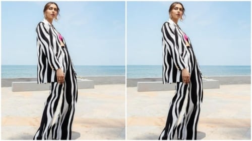 Get an inspiration from Rakul Preet by pairing a hot pink bralette with a monochrome pantsuit.&nbsp; (Instagram/@rakulpreet)