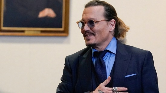 &nbsp;Johnny Depp gestures to spectators in court after closing arguments during his defamation case against ex-wife Amber Heard in May, 2022.(REUTERS)