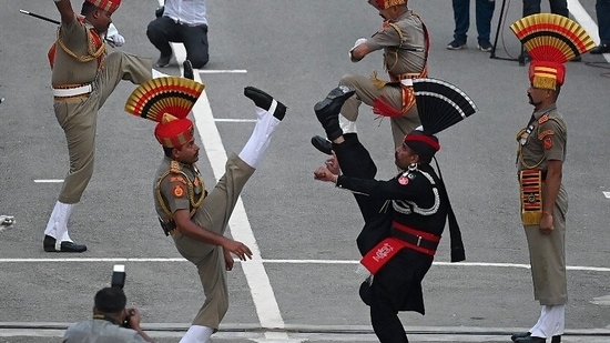 Guards performing beating the retreat ceremony on the eve of Independence day.(AFP)