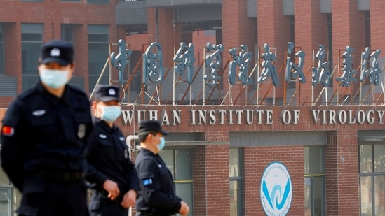 Security personnel keep watch outside the Wuhan Institute of Virology.(Reuters)