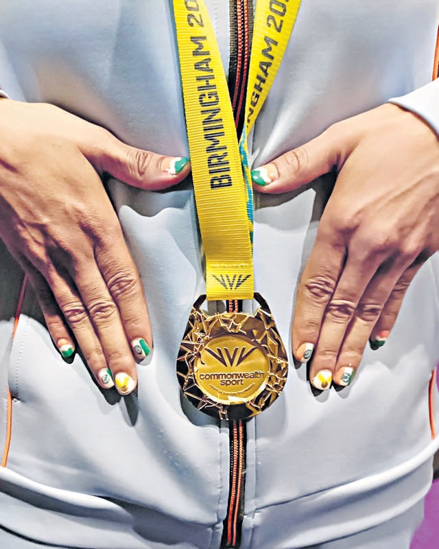 Nikhat wore her love for the nation on her nails at CWG, with nail art featuring the Tricolour and gold medal. (Photo: Twitter) Nikhat wore her love for the nation on her nails at CWG, with nail art featuring the Tricolour and gold medal. (Photo: Twitter)