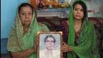 Family members of Lance Naik Chandrashekhar Harbola, whose body was found after 38 years, show his photograph in Uttarakhand’s Haldwani. (HT Photo)