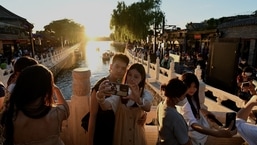 Although Beijing ended its draconian "one-child rule" in 2016 and last year allowed couples to have three children, birth rates have slipped over the past five years. (Photo by Noel Celis/AFP)