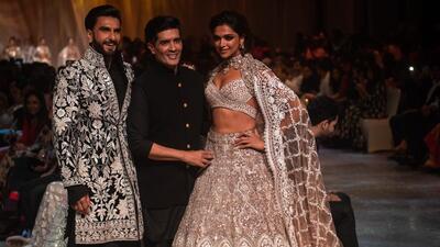 Actors Deepika Padukone and Ranveer Singh with designer Manish Malhotra walk on the ramp during Mijwan Fashion show (Pratik Chorge/HT) Actors Deepika Padukone and Ranveer Singh with designer Manish Malhotra walk on the ramp during Mijwan Fashion show (Pratik Chorge/HT)