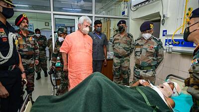Srinagar: Jammu and Kashmir Lt Governor Manoj Sinha visits the Army Hospital to meet ITBP personnel, who got injured after their bus skidded off a road, in Srinagar, Tuesday, Aug. 16, 2022. (PTI) Srinagar: Jammu and Kashmir Lt Governor Manoj Sinha visits the Army Hospital to meet ITBP personnel, who got injured after their bus skidded off a road, in Srinagar, Tuesday, Aug. 16, 2022. (PTI)