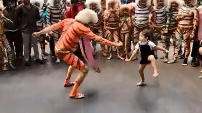 The image, taken from the Twitter video, shows the girl dancing with one of the folk dancers. (Twitter/@VisitUdupi)