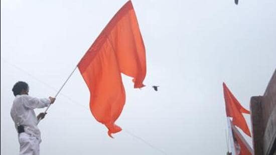 A supporter waves the Shiv Sena flag. (File Photo)