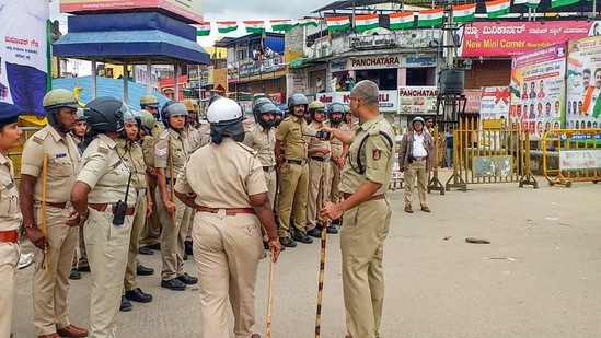 Police personnel deployed to maintain law and order after a dispute between two groups in Shivamogga.(PTI)