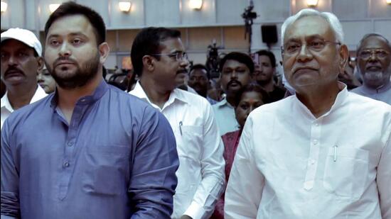 Patna, Aug 16 (ANI): Bihar Chief Minister Nitish Kumar with Deputy CM Tejashwi during the swearing-in ceremony of the Bihar Cabinet Expansion of Grand Alliance government at Raj Bhawan, in Patna on Tuesday. (ANI Photo) (Pappi Sharma)