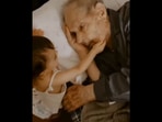 The baby girl and her great grandfather sharing a tender moment. (Instagram/@joanaconfraria) The baby girl and her great grandfather sharing a tender moment. (Instagram/@joanaconfraria)