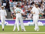 South Africa's Anrich Nortje celebrates with Dean Elgar after taking the wicket of England's Ben Foakes