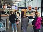 This file photo shows Russian tourists having their passport checked at the Nuijamaa border crossing, Finland. Finland will limit Russian tourist visas to 10 percent of current volumes as of September 1 due to rising discontent over Russian tourism amid the war in Ukraine, the Finnish government said (Photo by Alessandro RAMPAZZO / AFP) This file photo shows Russian tourists having their passport checked at the Nuijamaa border crossing, Finland. Finland will limit Russian tourist visas to 10 percent of current volumes as of September 1 due to rising discontent over Russian tourism amid the war in Ukraine, the Finnish government said (Photo by Alessandro RAMPAZZO / AFP)