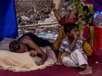 A&nbsp;Rohingya&nbsp;refugee family rests in a temporary shelter&nbsp;after a&nbsp;fire&nbsp;destroyed a Rohingya refugee camp in New Delhi,