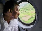Tulsiram Silawat conducting an aerial survey after a breach in a wall of an under-constuction dam over Karam river was reported, at Kothida in Dhar district, Sunday, Aug 14, 2022.(PTI)