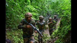 Indian army soldiers patrol near the Line of Control in Poonch district, Jammu and Kashmir. (PTI)